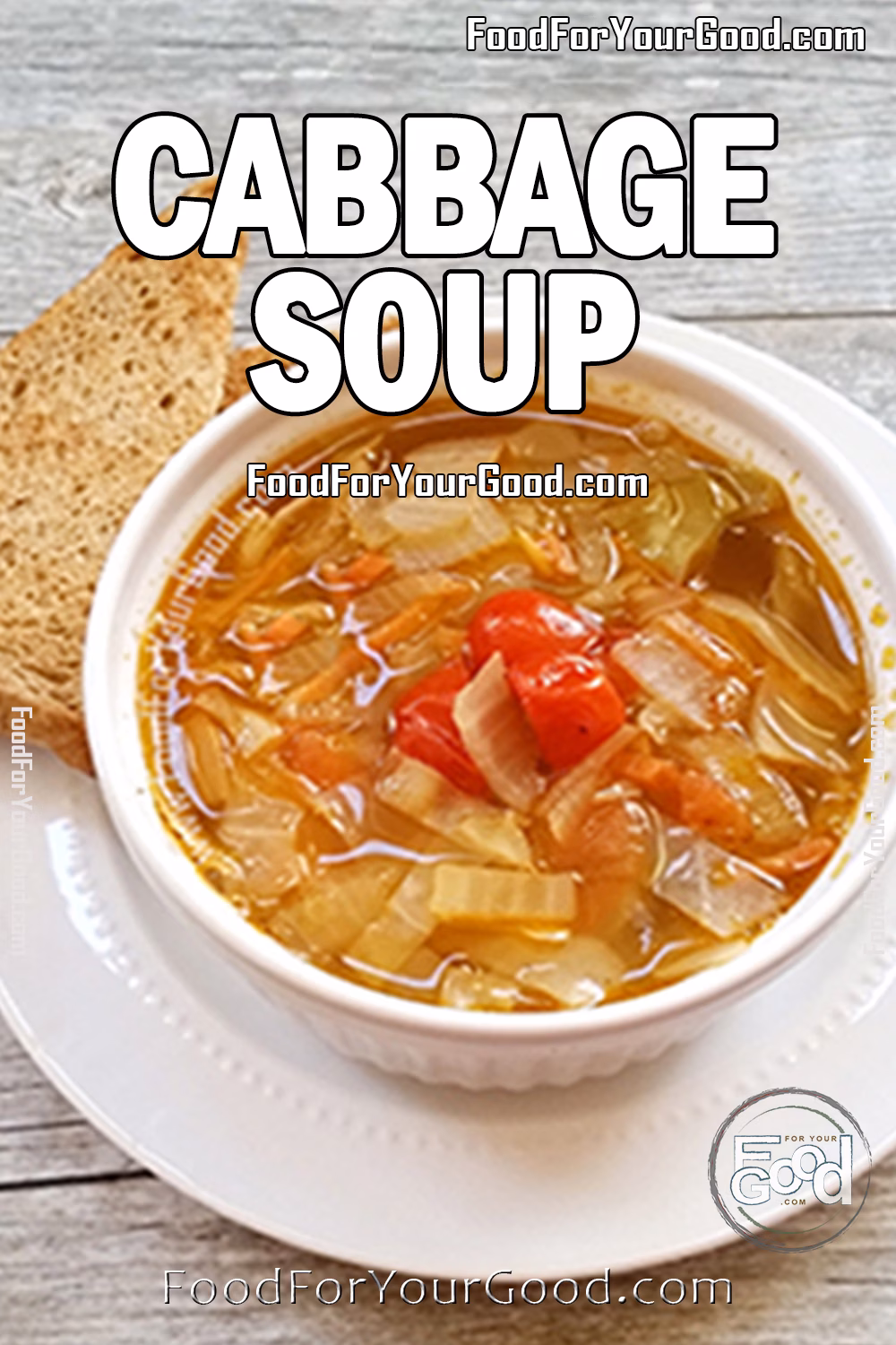 Bowl of cabbage soup with tomatoes, onions, and carrots, served with crisp bread on the side.