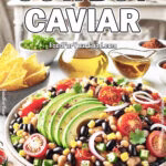 Colorful bowl of Cowboy Caviar salad made with black beans, corn, cherry tomatoes, avocado slices, red onion, and cilantro, served with tortilla chips.