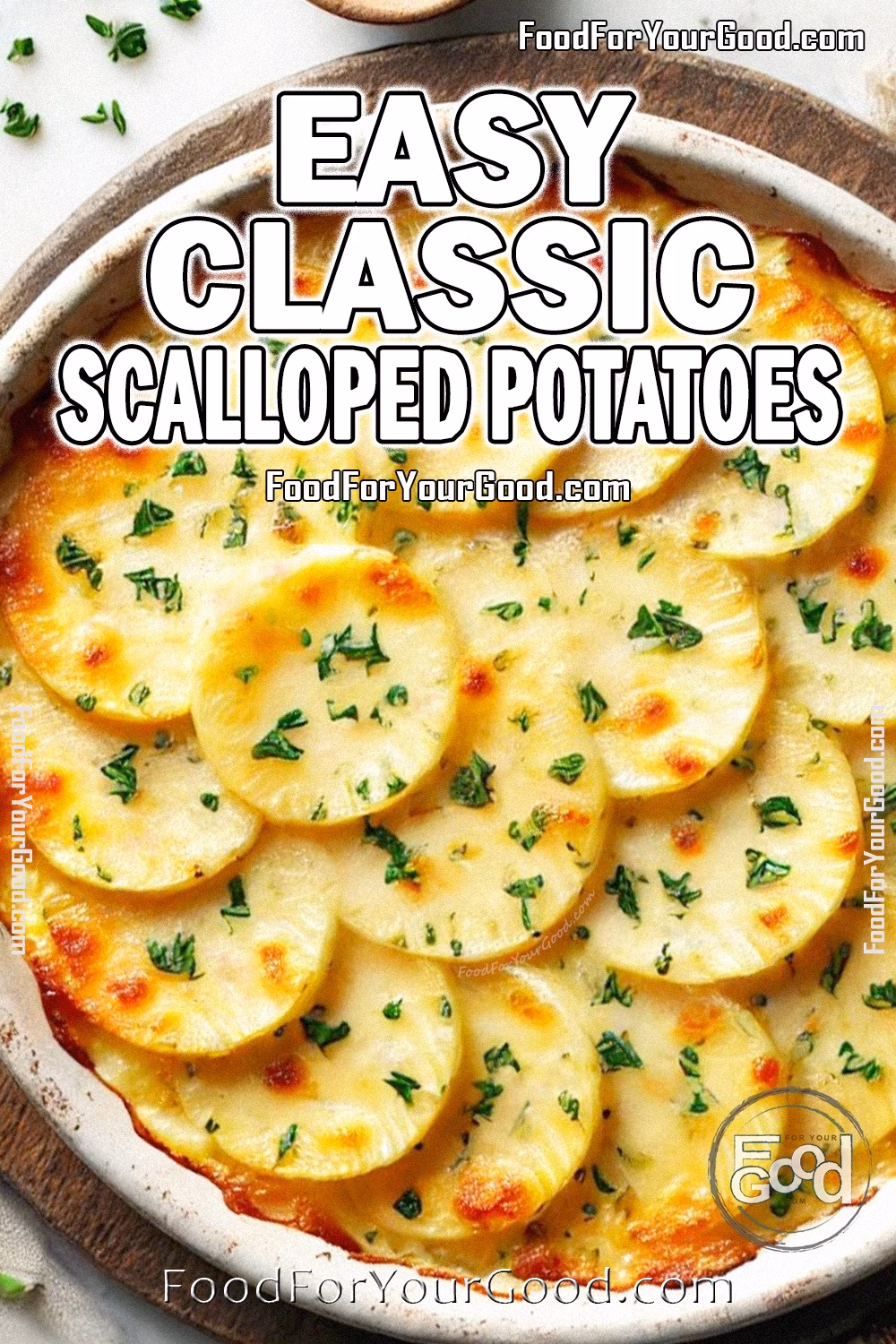 Easy Classic Scalloped Potatoes Recipe | FoodForYourGood.com Easy Classic Scalloped Potatoes baked in a white casserole dish with golden cheese and garnished with finely chopped chives. A comforting and simple recipe from FoodForYourGood.com