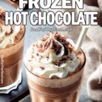 Ultimate Frozen Hot Chocolate topped with whipped cream and chocolate shavings in two modern glasses, set against a clean, luxurious background. A rich, creamy, and frosty chocolate drink perfect for any season. Recipe from FoodForYourGood.com