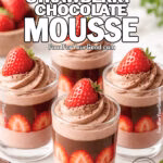 Glass cups of decadent strawberry chocolate mousse layered with strawberry slices, chocolate ganache, and topped with rustic chocolate mousse swirls and fresh strawberries on a white marble background.