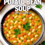 A steaming bowl of Hearty Potato Bean Soup filled with potatoes, white beans, carrots, and celery, garnished with fresh parsley, served at FoodForYourGood.com