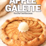 Homemade rustic apple galette topped with a small scoop of vanilla ice cream and sprinkled with brown sugar on a white marble background, with fresh apples in the blurry background.
