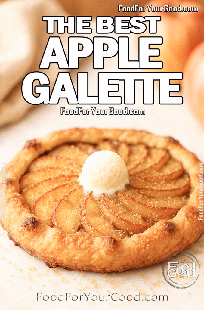 The Best Apple Galette Homemade rustic apple galette topped with a small scoop of vanilla ice cream and sprinkled with brown sugar on a white marble background, with fresh apples in the blurry background.
