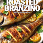 Crispy Lemon Roasted Branzino with golden, crispy skin and fresh lemon slices on a white plate, garnished with parsley. A flavorful and easy seafood recipe from FoodForYourGood.com
