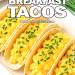 3-Ingredient Breakfast Tacos with scrambled eggs and cheddar cheese in a ceramic dish