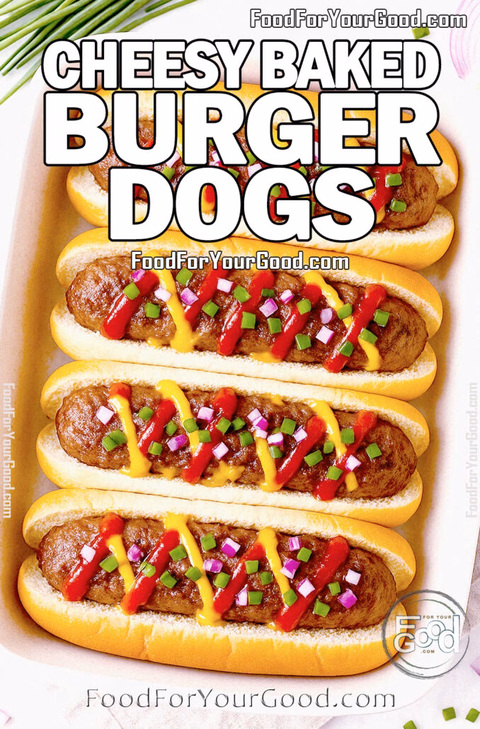 Cheesy Baked Burger Dogs Cheesy Baked Burger Dogs topped with ketchup, mustard, red onion, and chives in a ceramic baking dish on a linen towel.