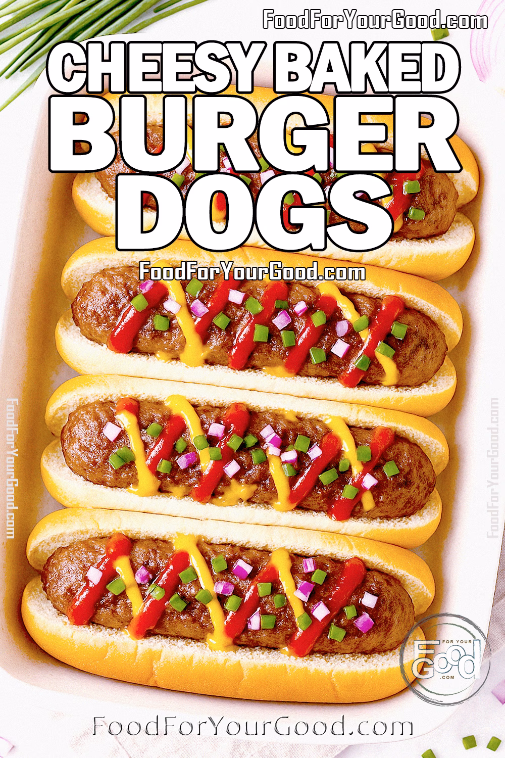 Cheesy Baked Burger Dogs in Buns with Toppings – FoodForYourGood.com Cheesy Baked Burger Dogs topped with ketchup, mustard, red onion, and chives in a ceramic baking dish on a linen towel.