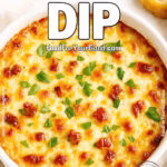 Marry Me Dip in a white baking dish with toasted baguette slices on marble background