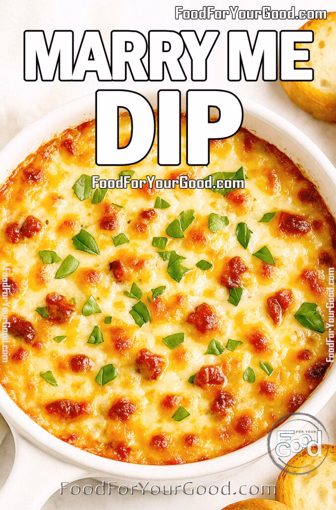 Marry Me Dip Marry Me Dip in a white baking dish with toasted baguette slices on marble background