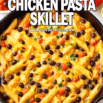 Creamy Southwest Chicken Pasta in cast iron skillet with black beans, corn, tomatoes, and cilantro, surrounded by fresh ingredients