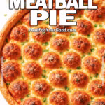Freshly baked Stuffed Meatball Pie in a golden crust, filled with mozzarella-topped meatballs and garnished with parsley, served with marinara sauce.