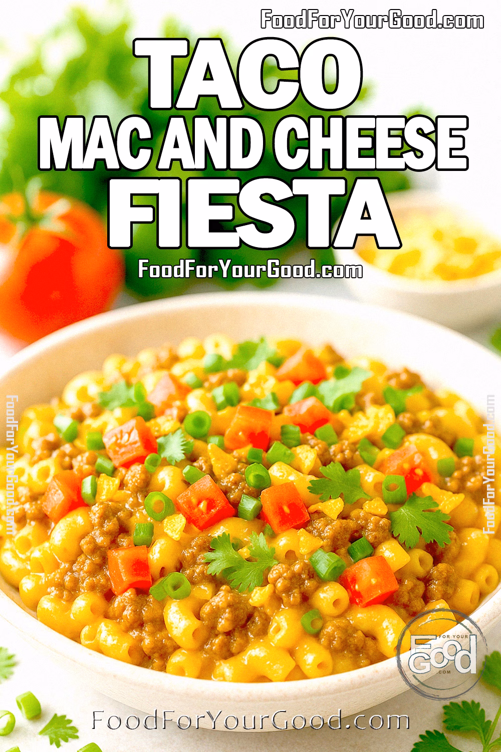 Taco Mac and Cheese Fiesta from FoodForYourGood.com Bright and colorful bowl of taco mac and cheese topped with beef, tomatoes, green onions, cilantro, and tortilla chips, with fresh ingredients in the blurred background.