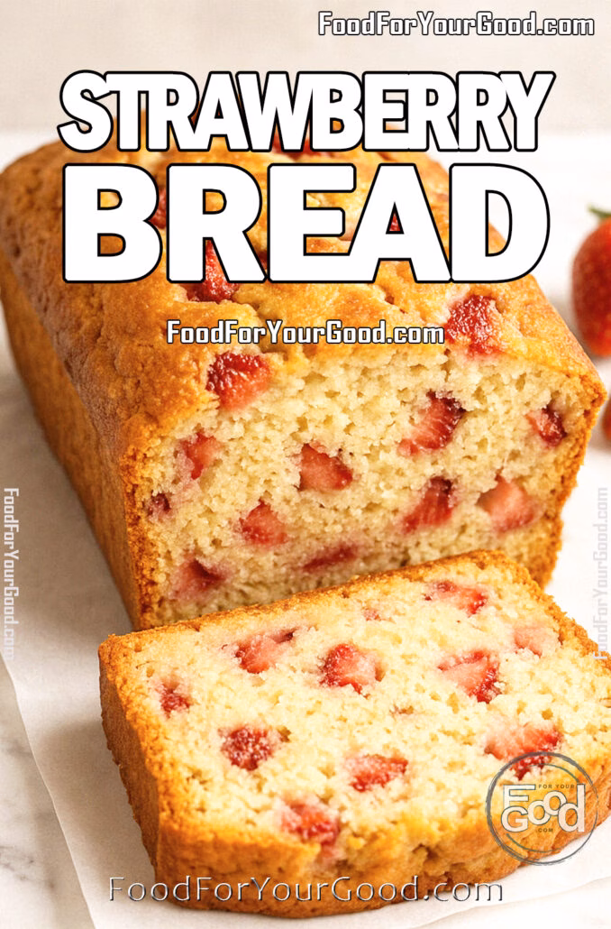 Sliced strawberry bread loaf with visible fresh strawberry chunks on a marble surface.