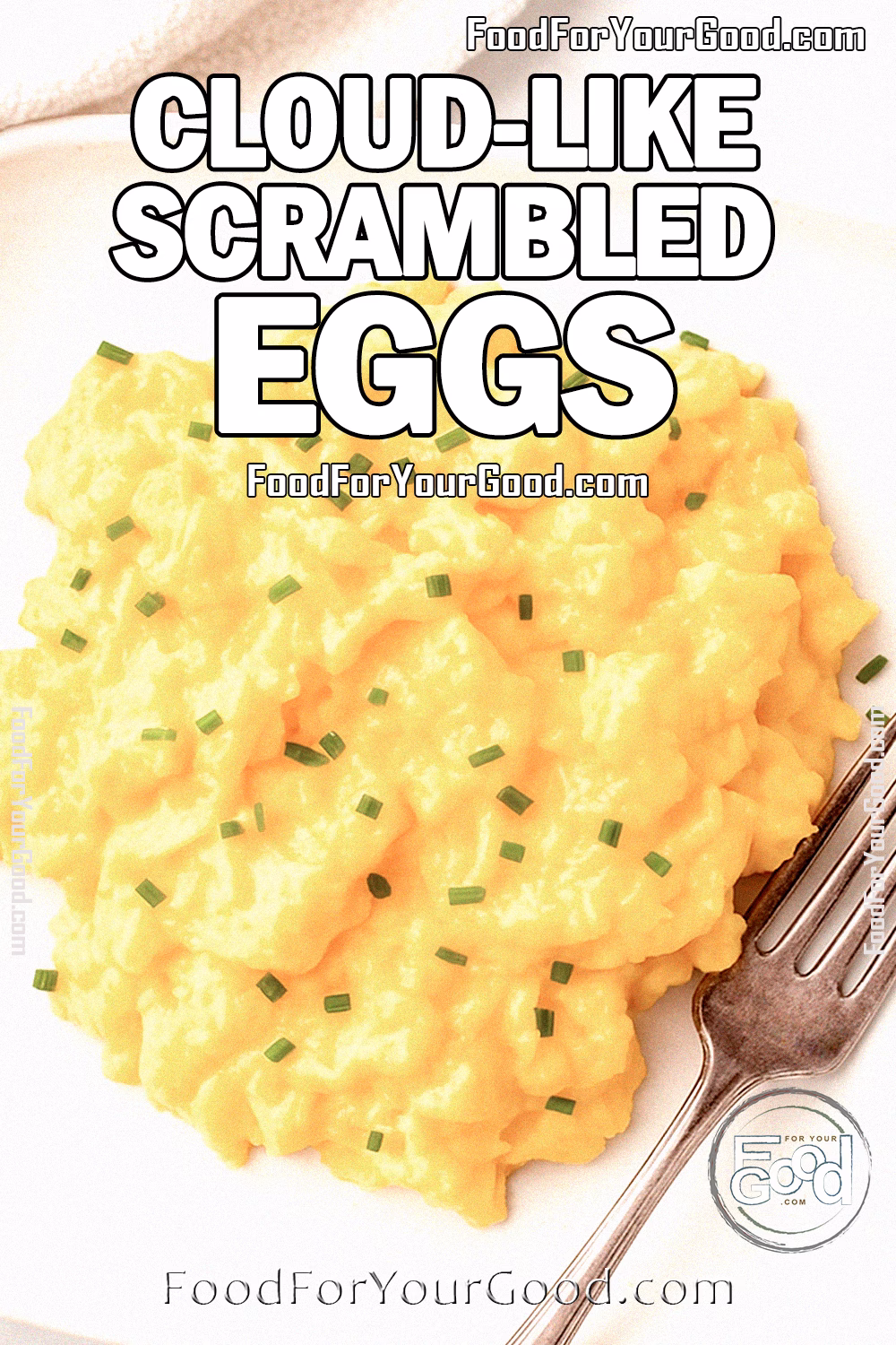 Cloud-Like Scrambled Eggs on FoodForYourGood.com Cloud-Like Scrambled Eggs served on a white square plate with fork and chives on top, on marble background
