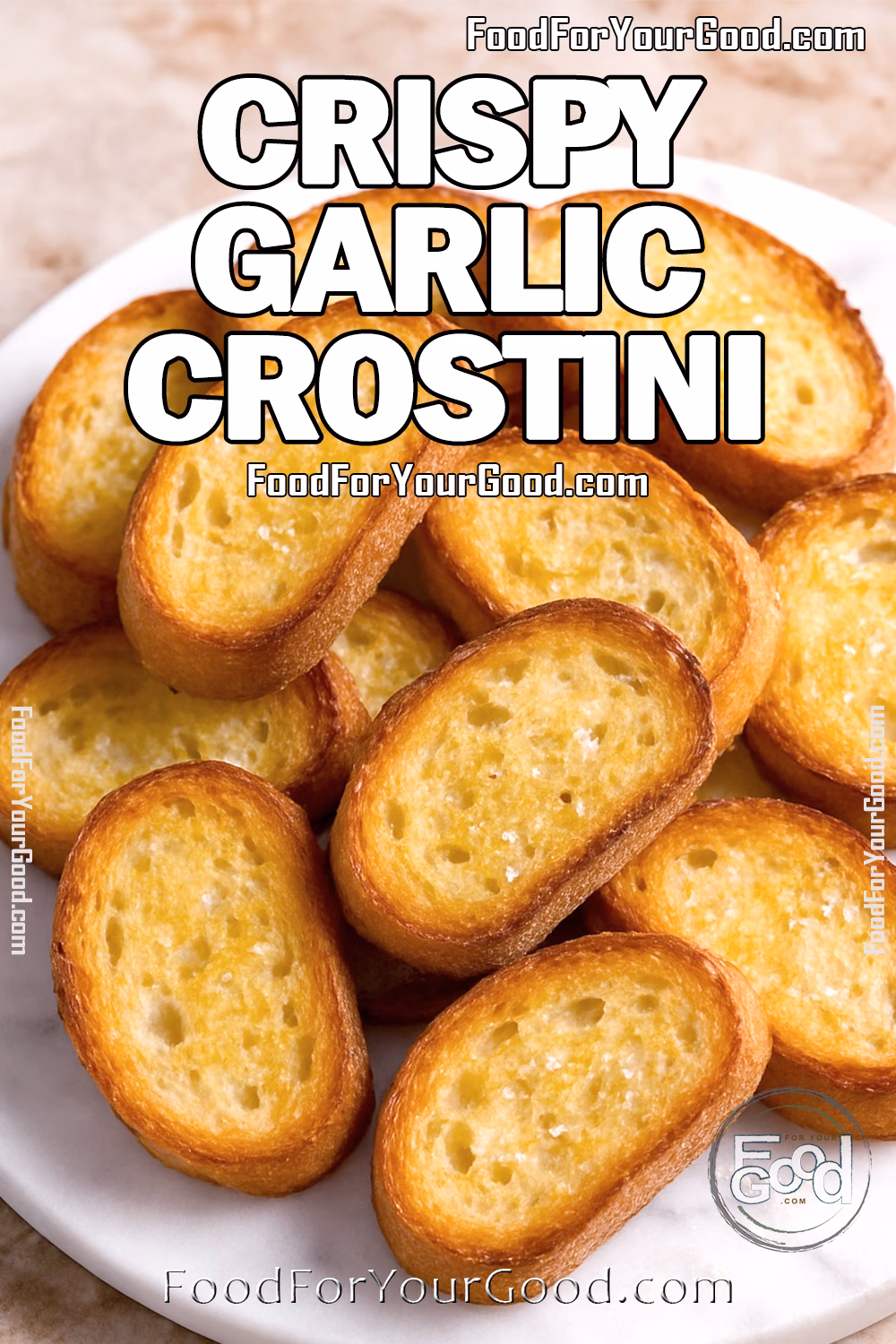 Crispy Garlic Crostini on FoodForYourGood.com A pile of golden, crispy garlic crostini on a white marble plate, perfect as an appetizer base.