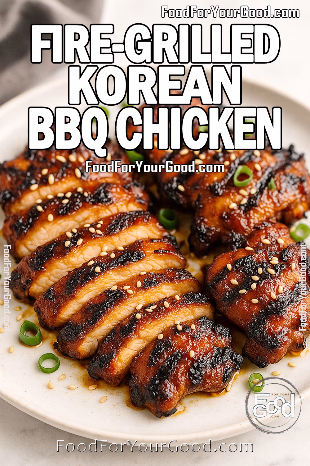Sliced fire-grilled Korean BBQ chicken thighs with sesame seeds and green onions on a plate.