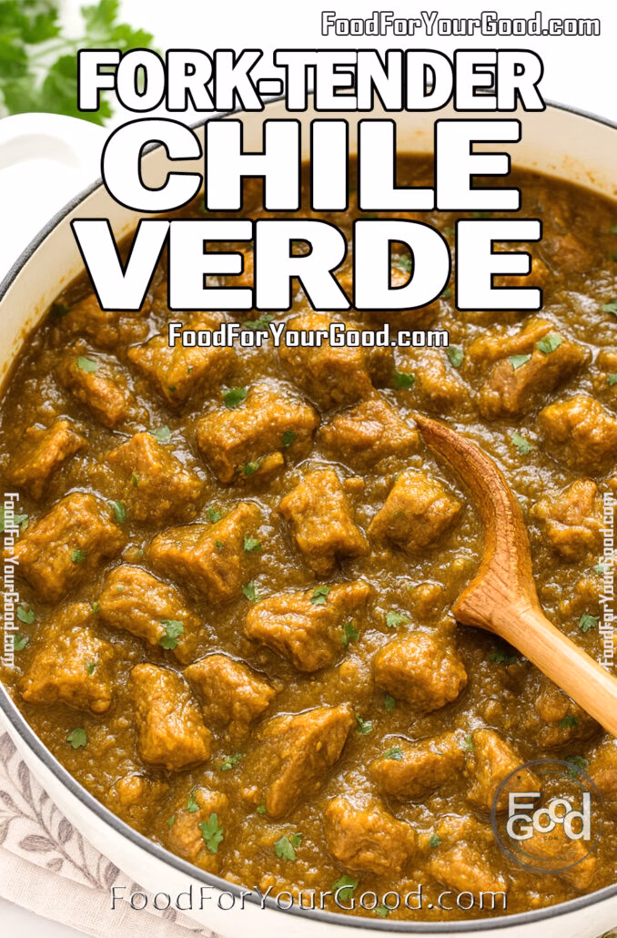 Fork-Tender Chile Verde A white Dutch oven filled with fork-tender pork chile verde in a thick green sauce, garnished with cilantro, with a wooden spoon and white towel beneath.