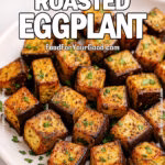 Garlic Herb Roasted Eggplant served on a white ceramic plate, garnished with parsley.