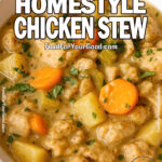 A bowl of creamy homemade chicken stew filled with tender chicken chunks, carrots, potatoes, and herbs.