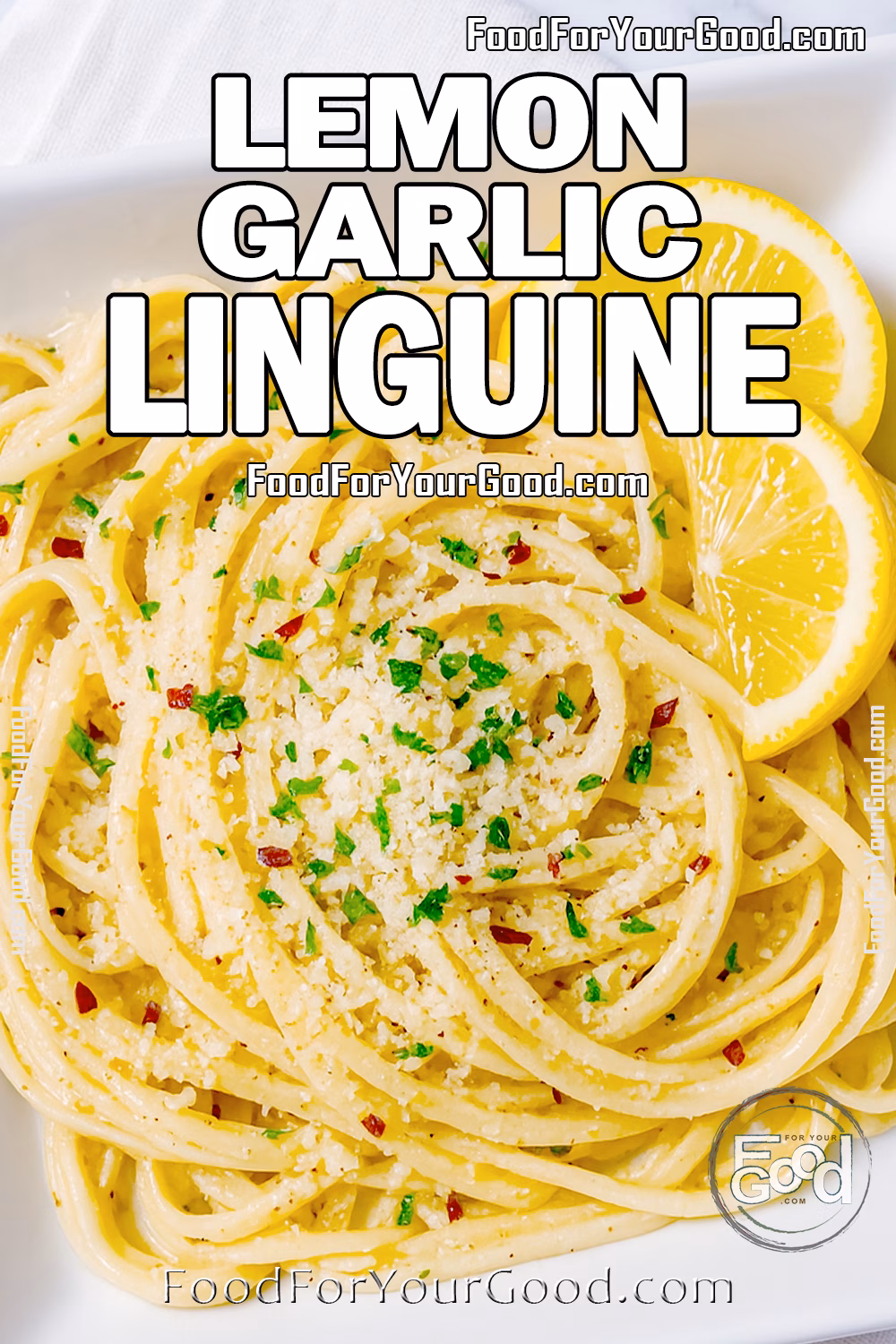 Lemon Garlic Linguine in White Bowl on Marble Lemon Garlic Linguine served in a white square bowl with lemon wedges and Parmesan on marble.