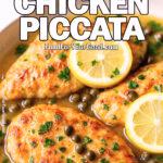 Skillet Chicken Piccata with lemon slices, capers, and fresh parsley in buttery sauce