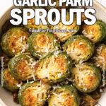 Air-fried Brussels sprouts in a rustic bowl topped with Parmesan cheese on a white marble surface
