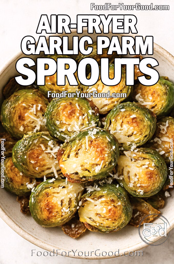 Air-fried Brussels sprouts in a rustic bowl topped with Parmesan cheese on a white marble surface