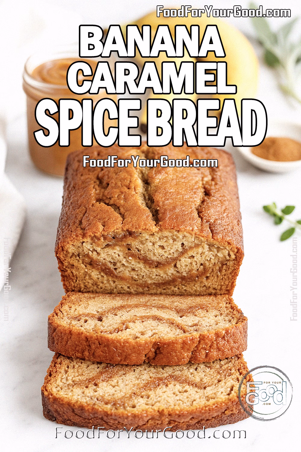 Banana Caramel Spice Bread Recipe – FoodForYourGood.com Golden Banana Caramel Spice Bread sliced to reveal moist crumb and caramel swirls, styled on white marble with bananas, caramel, and cinnamon in the background.