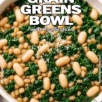 A cozy bowl of the Bean Grain Greens Bowl with kale, white beans, and farro on FoodForYourGood.com