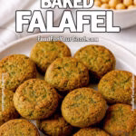 A plate of golden, oven-baked falafel served on a ceramic dish with a bowl of chickpeas and a white towel in the background.