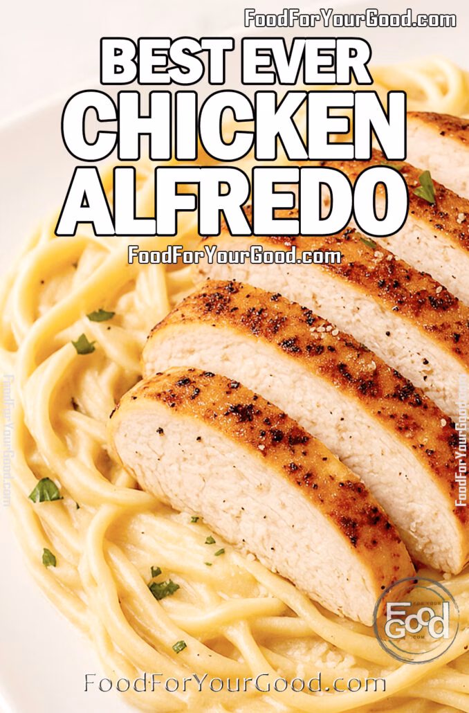 Creamy fettuccine Alfredo topped with golden sliced chicken breast, served on a white square plate.