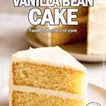 A slice of homemade Best Vanilla Bean Cake with vanilla frosting on a ceramic plate