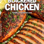 Bold Blackened Chicken Breasts sliced and served with lime wedges and parsley on a square ceramic plate