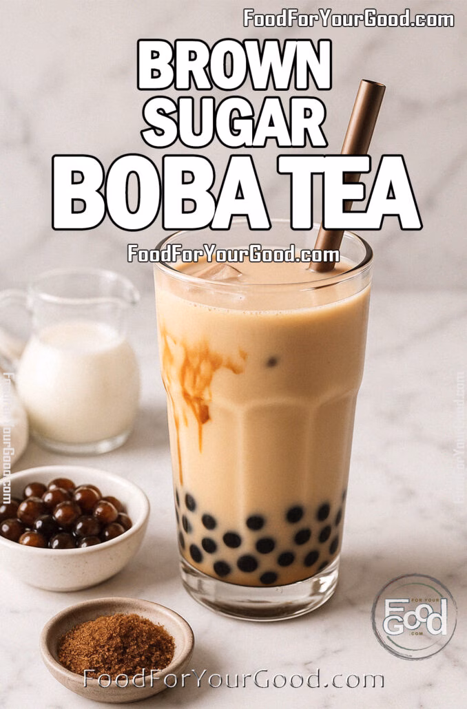 A glass of Brown Sugar Boba Tea on a white marble countertop, with tapioca pearls, brown sugar, and milk arranged nearby for a cozy, modern presentation.