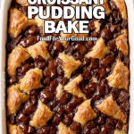 Chocolate Croissant Pudding Bake in a white ceramic dish on a marble countertop, with golden croissant pieces, melted chocolate, a cup of coffee, scattered chocolate chips, and a soft white towel in the background.