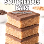Chocolate Scotcheroos Bars stacked on marble countertop with blurred background of ingredients.