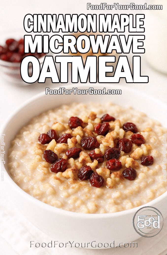 A white bowl filled with creamy Cinnamon Maple Microwave Oatmeal topped with cranberries and walnuts on a marble countertop.