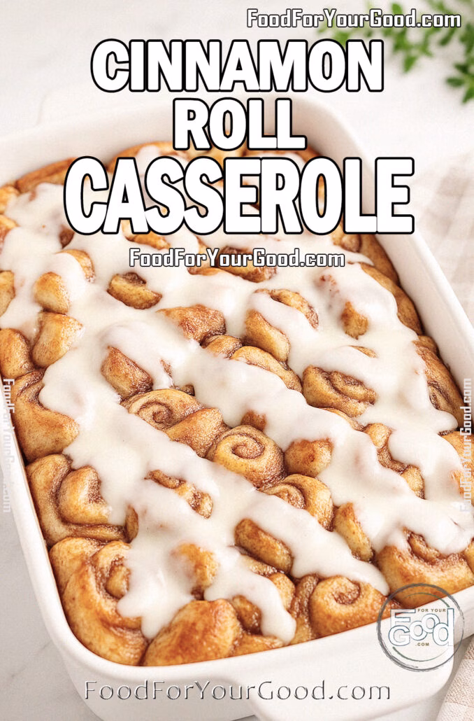 Cinnamon Roll Casserole Cinnamon Roll Casserole baked golden in a white ceramic dish, drizzled with cream cheese glaze, styled on marble with a white towel and herbs for FoodForYourGood.com