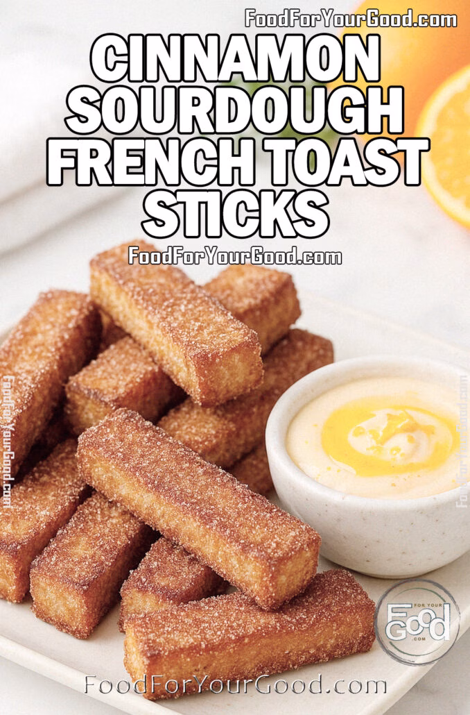 Cinnamon Sourdough French Toast Sticks Cinnamon Sourdough French Toast Sticks with orange honey butter dip on a white marble surface, styled with oranges and herbs for FoodForYourGood.com