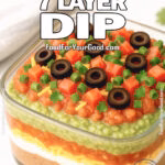 Classic 7 Layer Dip with fresh guacamole, salsa, beans, sour cream, and toppings
