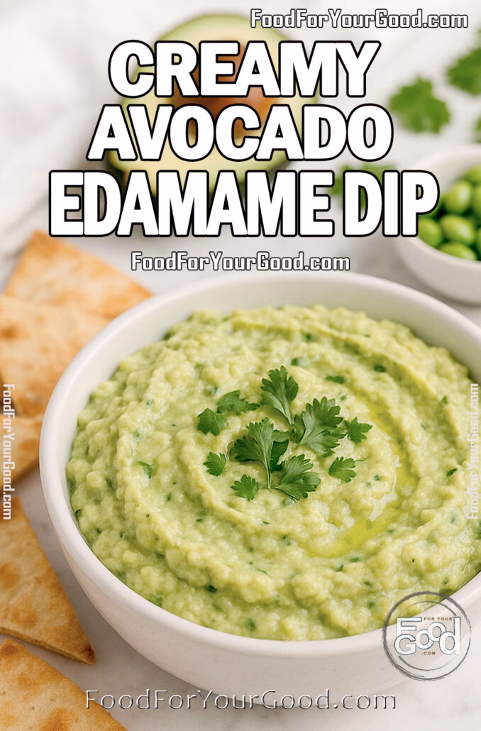 Homemade-style avocado edamame dip in a white bowl with rustic texture, topped with cilantro, on marble with pita chips.