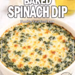 Homemade Creamy Baked Spinach Dip with a golden cheesy crust served in a white dish on marble, styled with fresh spinach, garlic, onion, and Parmesan in the background.