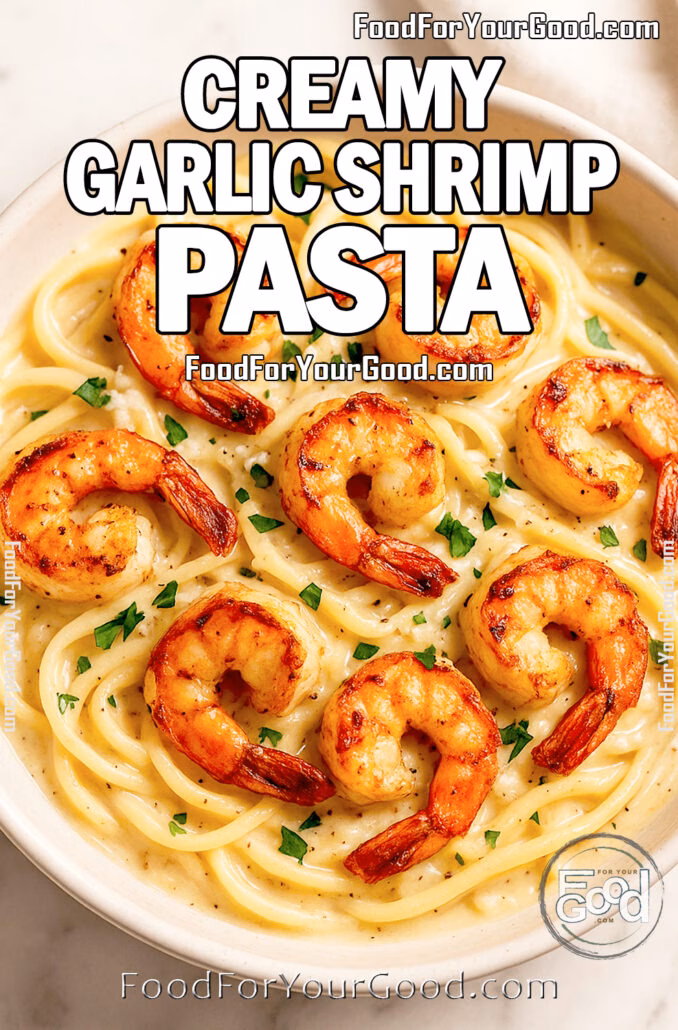 Close-up of creamy garlic shrimp pasta with crispy shrimp in white bowl on marble countertop