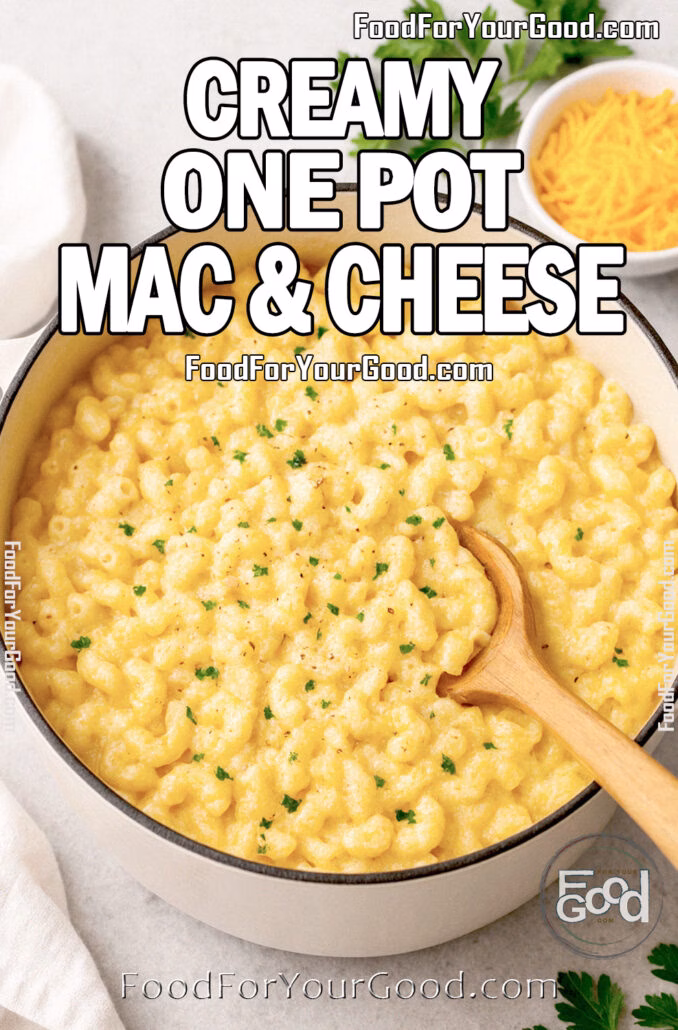 Creamy One Pot Mac & Cheese Creamy One Pot Mac & Cheese in a Dutch oven with fresh parsley and shredded cheddar on a marble surface.