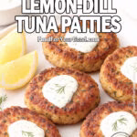 Crisp Lemon-Dill Tuna Patties on a white plate with lemon wedges, fresh dill sprigs, and a bowl of lemon-dill sauce on FoodForYourGood.com