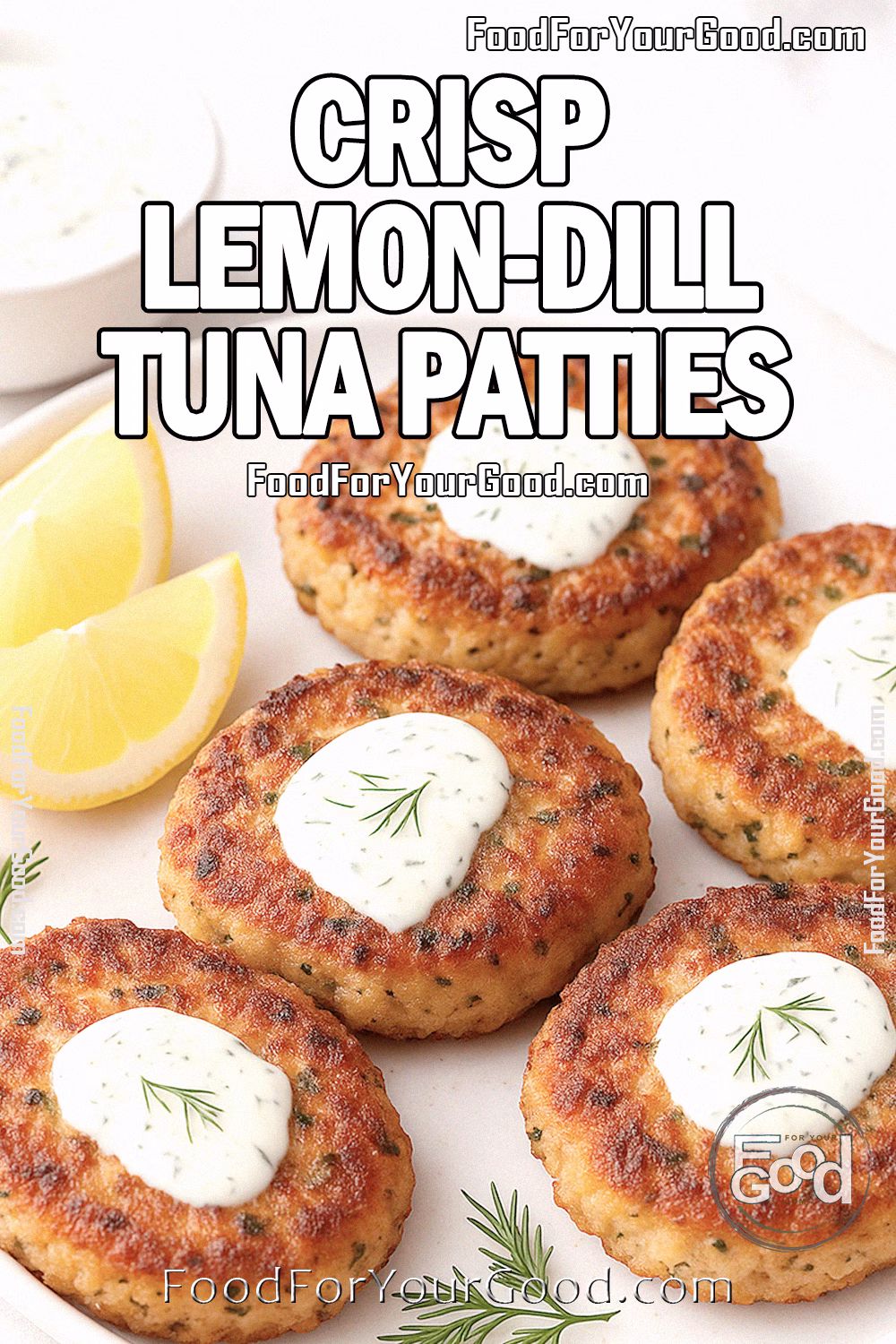 Crisp Lemon-Dill Tuna Patties on a white plate with lemon wedges, fresh dill sprigs, and a bowl of lemon-dill sauce on FoodForYourGood.com