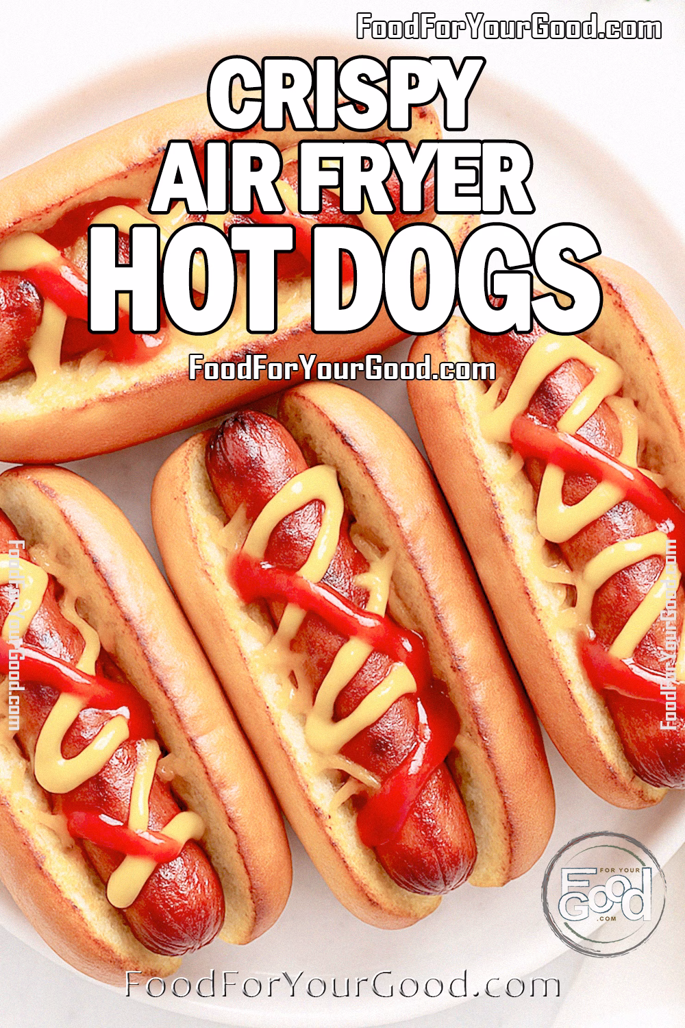 Crispy Air Fryer Hot Dogs Recipe | FoodForYourGood.com Crispy Air Fryer Hot Dogs on golden toasted buns with melted cheddar, ketchup, and mustard, served on a white plate over marble.