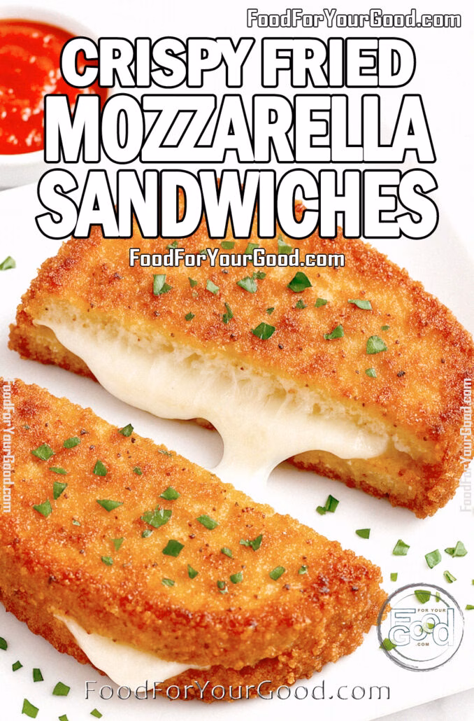 One fried mozzarella sandwich cut into two halves with golden crust and melted cheese, garnished with chopped basil, served on a white square plate with marinara sauce on marble background.