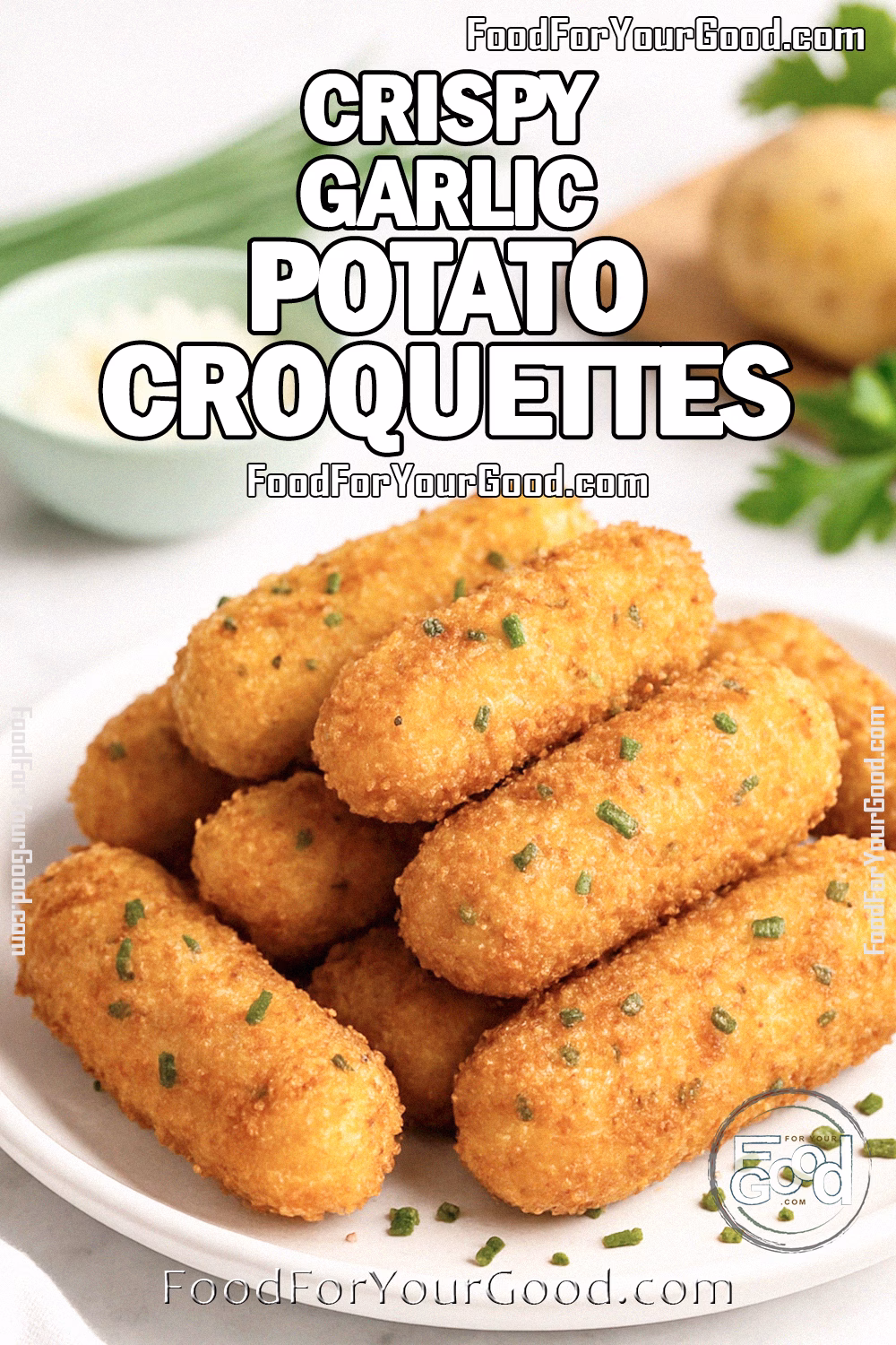 Crispy Garlic Potato Croquettes Recipe – FoodForYourGood.com Crispy Garlic Potato Croquettes stacked on a white plate with chives, Parmesan, and potatoes on a marble background.